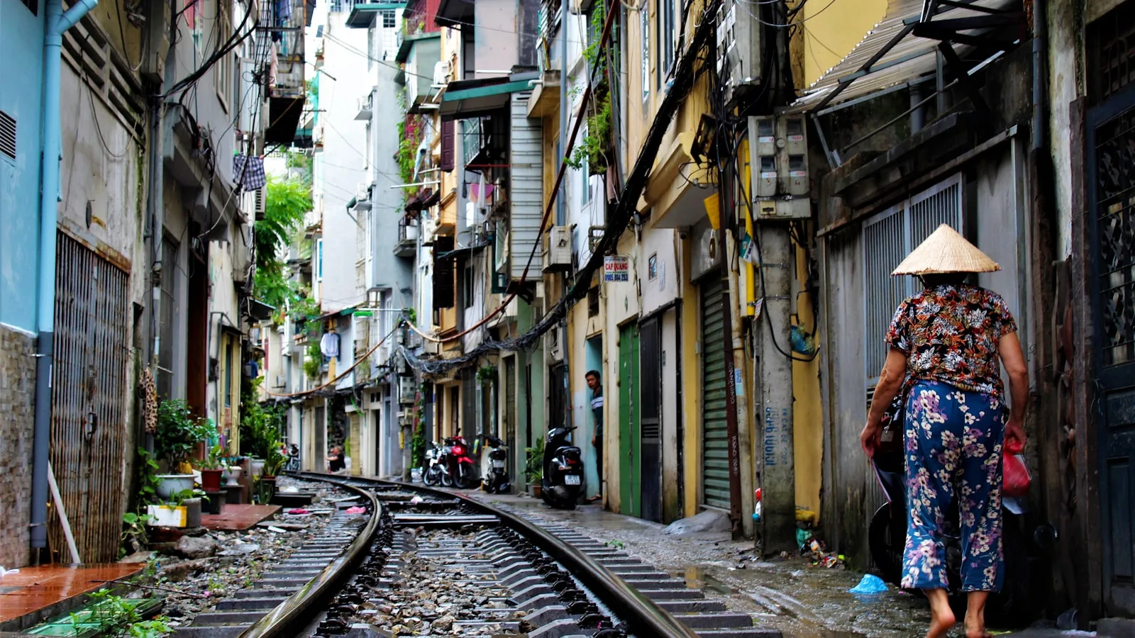 A person beside railway tracks in Hanoi