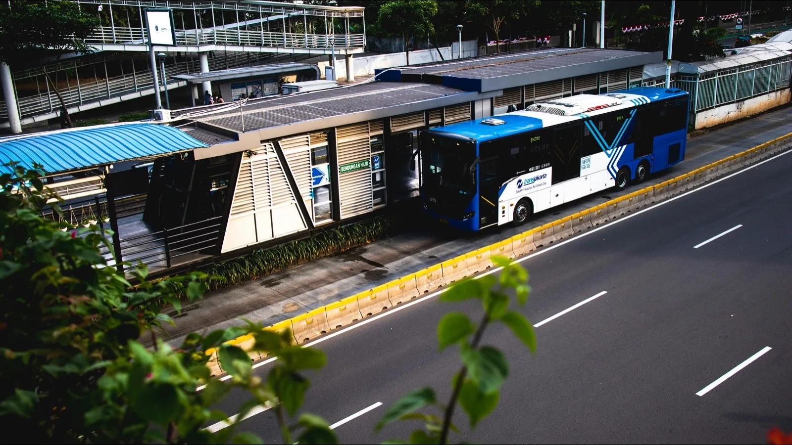 A Transjakarta bus at a stop in Indonesia