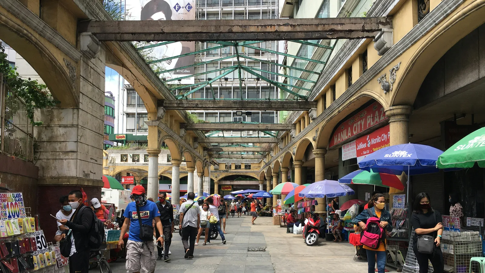 Pedestrians on a market street in Manila