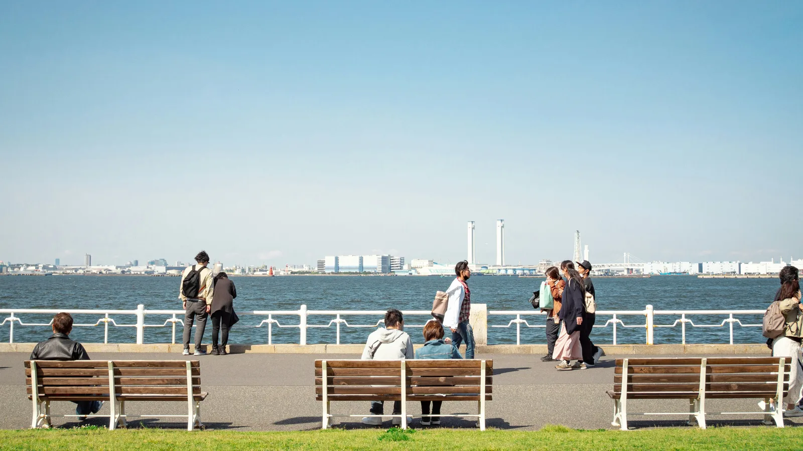 People on a waterfront promenade in Yokohama